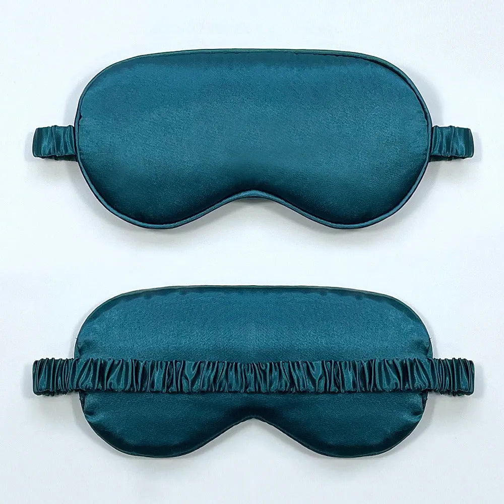 Reversible silk-like sleep eyeshade shown in multiple colour options including sky blue, wine red, and black.
