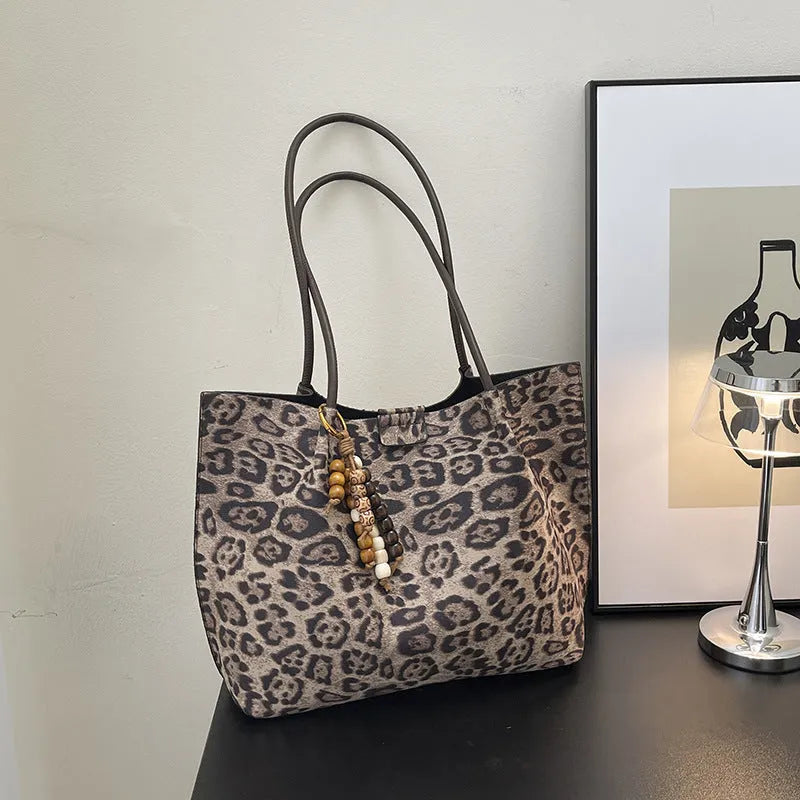 Leopard print polyester hand-held tote bag with double shoulder straps on a white background