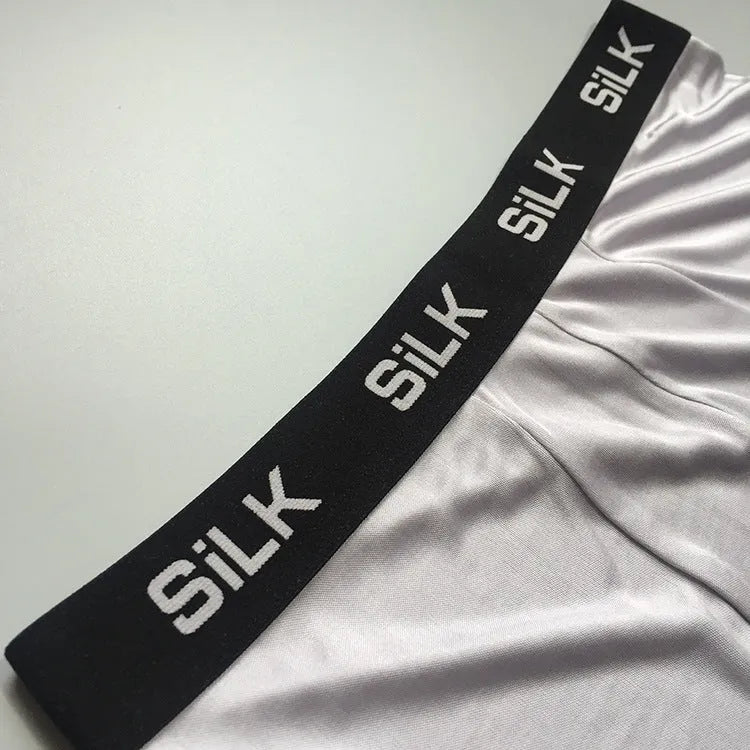 Men's silk shorts in loose fit with mid waist, available in navy blue, silver grey or skin colour