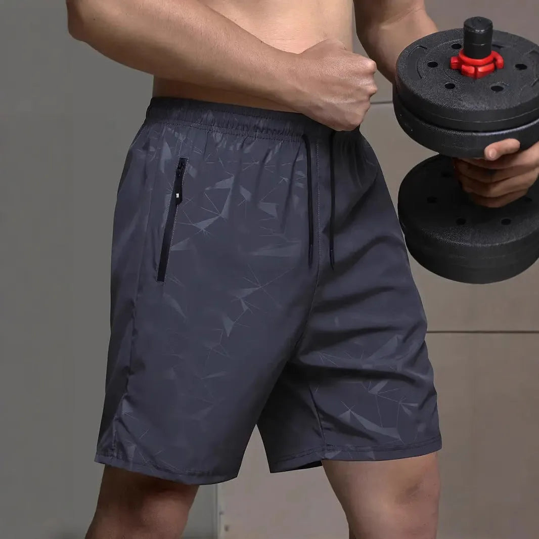 Men's black loose-fit polyester sports shorts with an elasticated waistband.