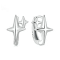 Minimalist sterling silver star ear clips with oxidised finish and ear clip design