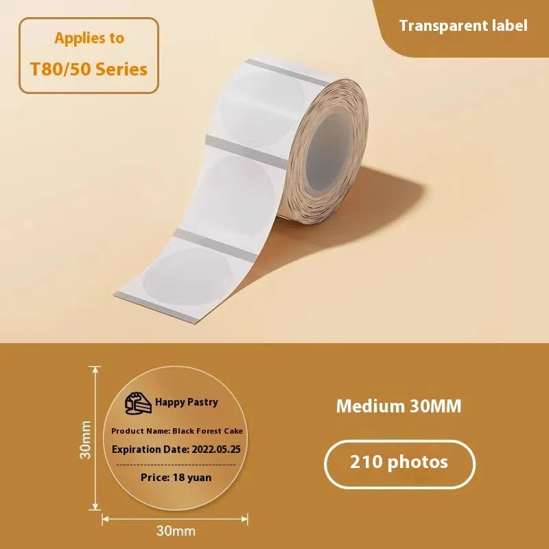 Roll of transparent waterproof adhesive labels showing rectangular and round sizes on thermal synthetic paper.