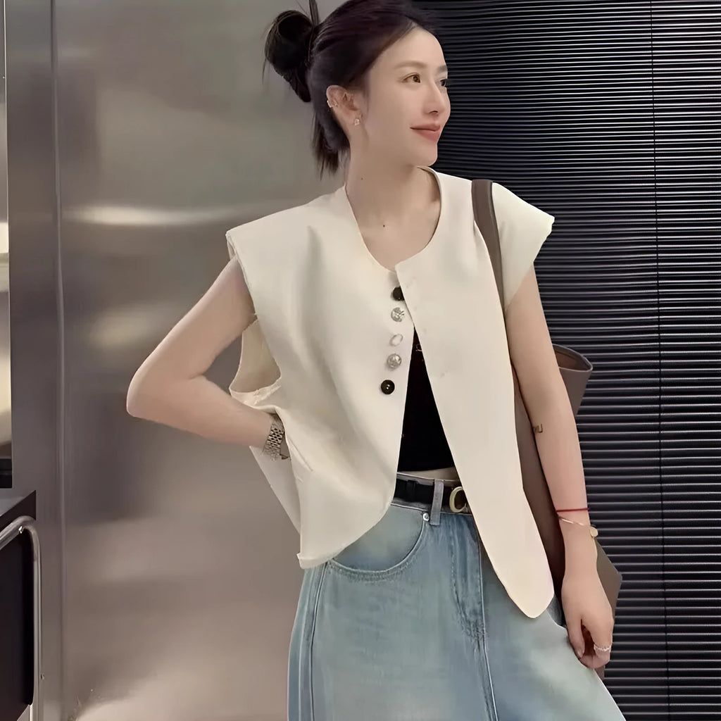 Women's loose-fit polyester vest in milky white with a pocket, shown on a hanger.