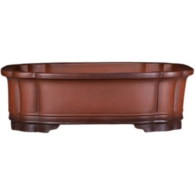 Large antique-finish Chinese purple clay flowerpot shaped like a tree stump with decorative carvings.