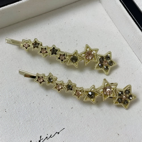 Gold alloy hair barrette with rhinestones and a star charm, shown as a side clip for bangs.