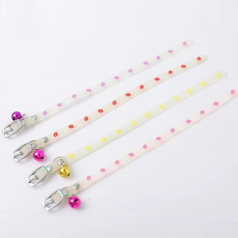 Luminous cat collar with adjustable silicone strap and metal bell in paw print pattern