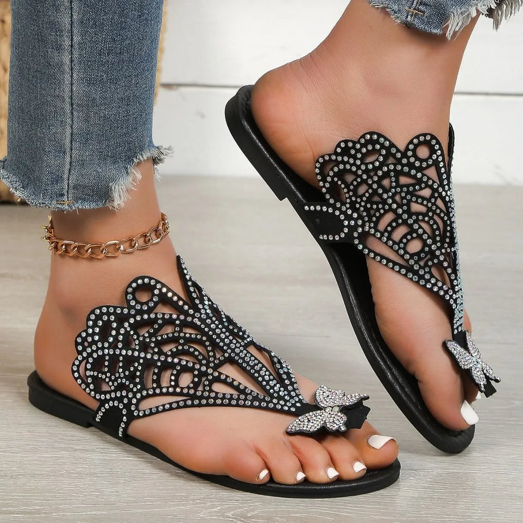 Women's black rhinestone flip-toe sandals with slip-on design and flat rubber sole