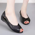 Women's casual peep toe sandal with ankle buckle on a rubber mid-heel sole in peacock blue