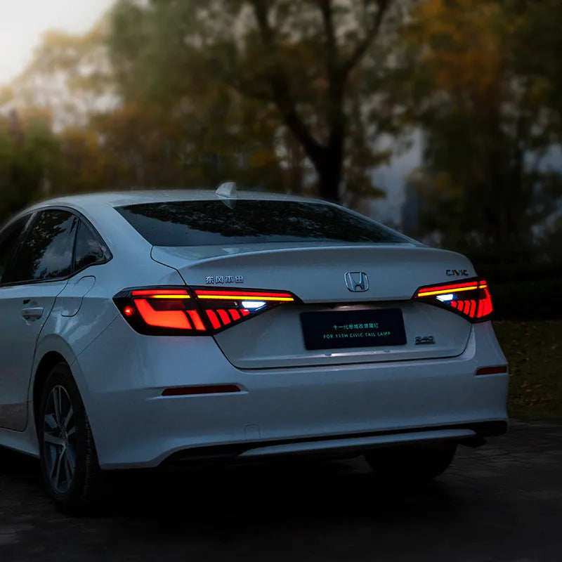 11th Generation Honda Civic black and red LED tail light assembly with sequential turn signal streamer.
