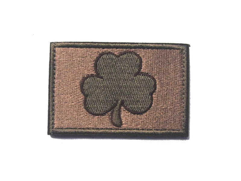 Outdoor embroidered fabric badge with Velcro backing on a tactical vest.