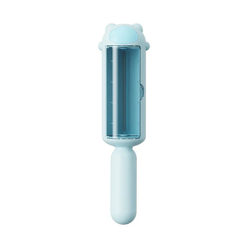 Blue reusable pet hair remover roller with a self-cleaning base on a fabric sofa.
