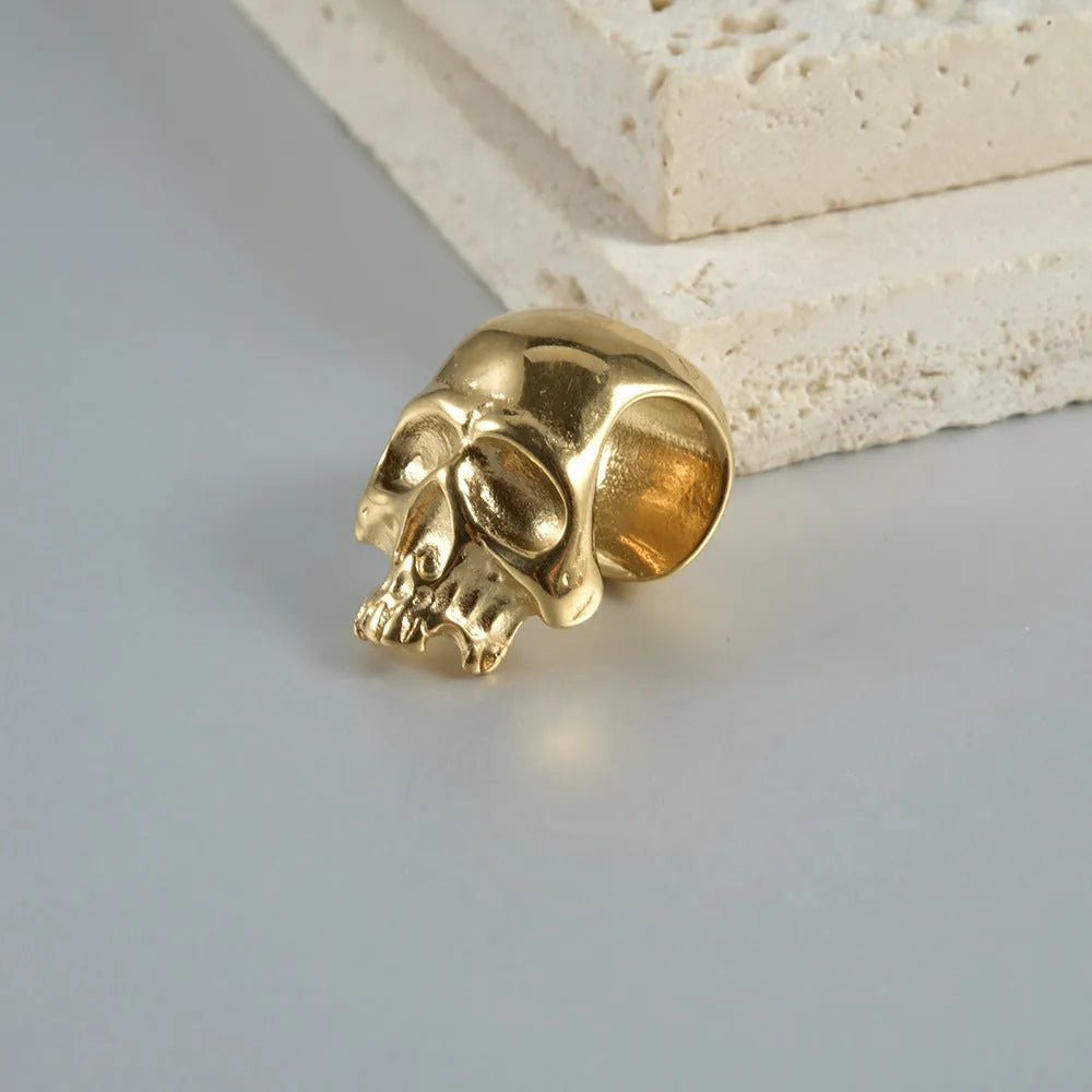 Stainless steel hollow skull Buddha earrings with geometric hip hop design in electroplated finishes