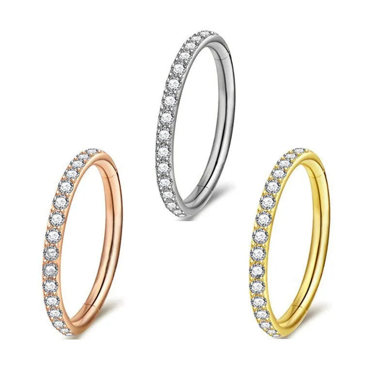 A round stainless steel seamless nose ring shown in gold, rose gold, black, and steel colour finishes.