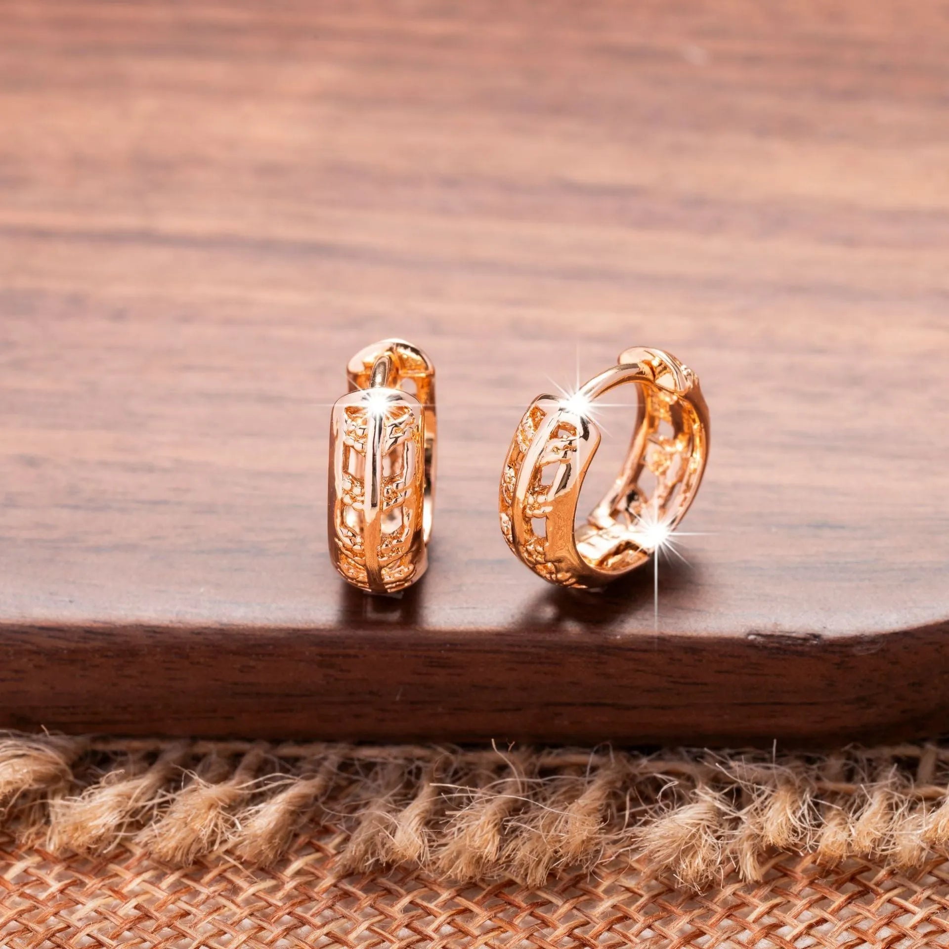 Rose gold hollow leaf earrings with a heart detail, made from copper.