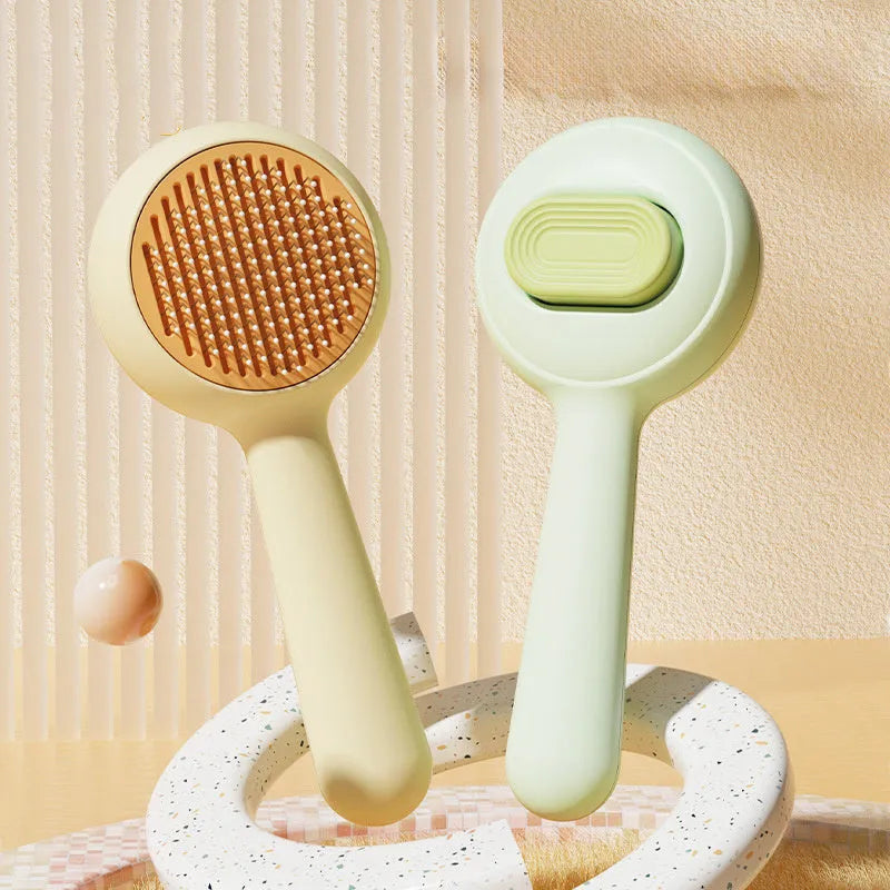 Stainless steel pet grooming brush with a coloured non-slip plastic handle for cats and dogs.
