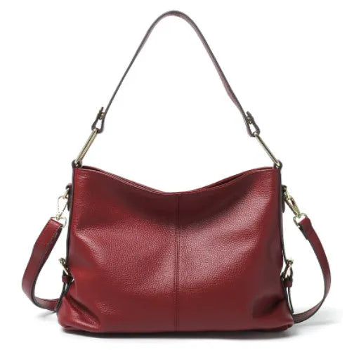 Genuine leather women's crossbody bag in square vertical design, showing internal zipped phone and document pockets.