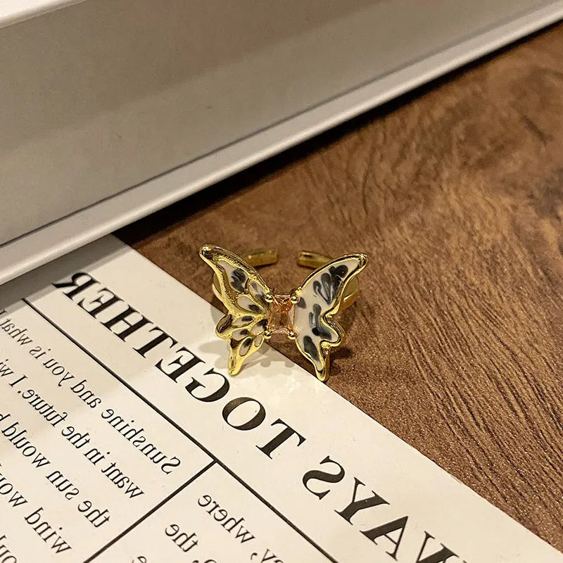 Women's copper butterfly ring with dripping oil finish and adjustable open loop design