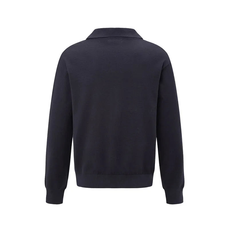 Loose black chemical fibre blend pullover shirt on hanger