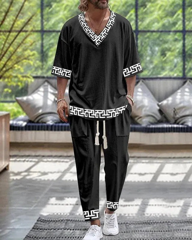 Polyester cropped sleeve V-neck jacket and trousers suit set on a hanger.
