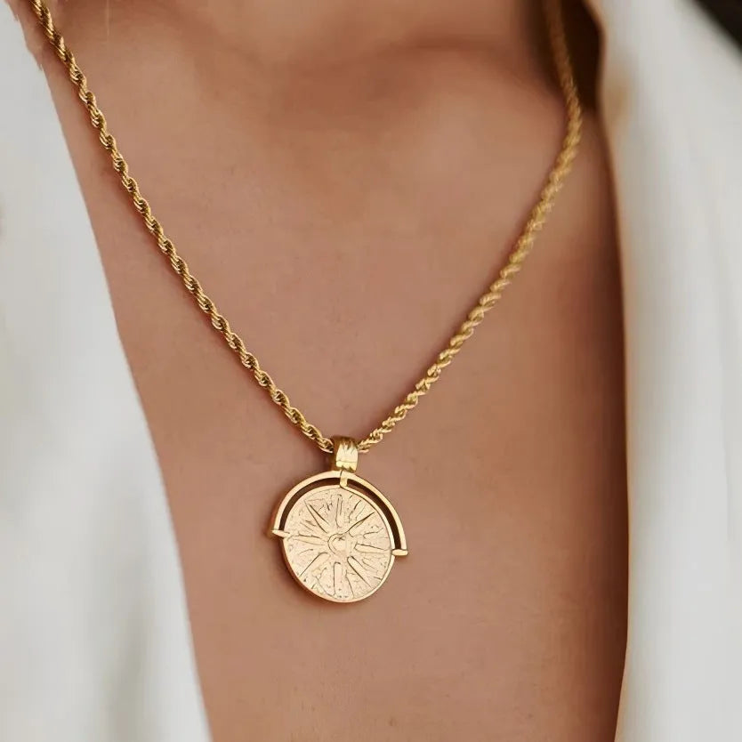 Stainless steel necklace with round embossed sunflower pendant featuring six-pointed stars on adjustable chain