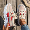 Women's Flyknit lace-up sneakers in a selected colour with a low rubber sole and round toe