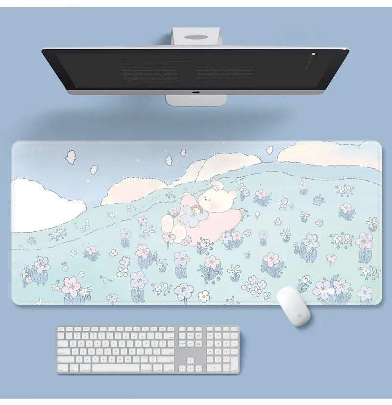 Large flower pattern mouse pad on a desk with keyboard, showing non-slip rubber base and colourful tulip design.