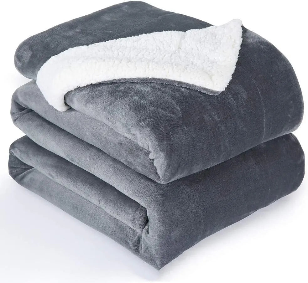 Grey and white USB electric heating blanket with temperature controls on soft flannel fabric.