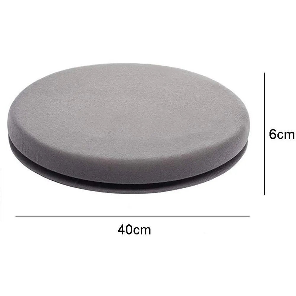 Circular grey rotating car seat cushion with plush fabric on a car seat.