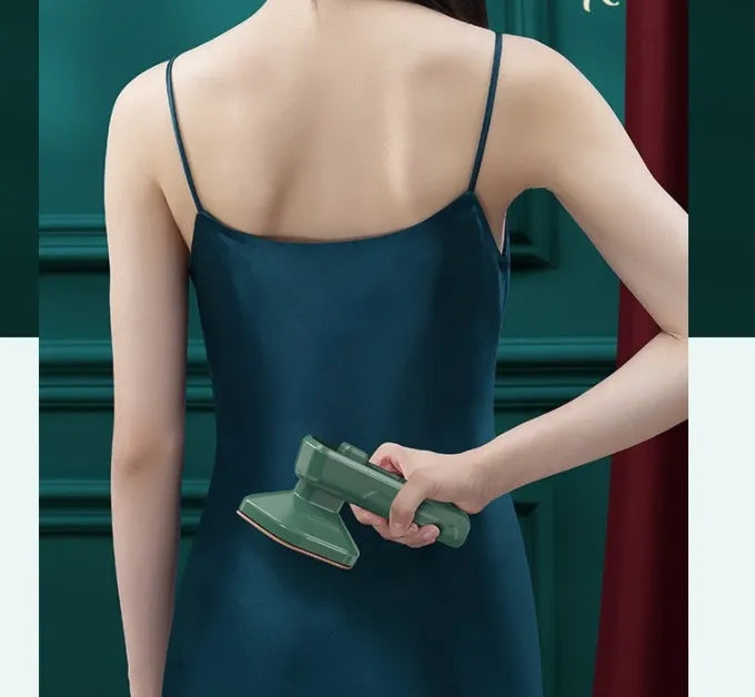 Dark green portable hanging steam iron machine with ceramic panel and compact design.