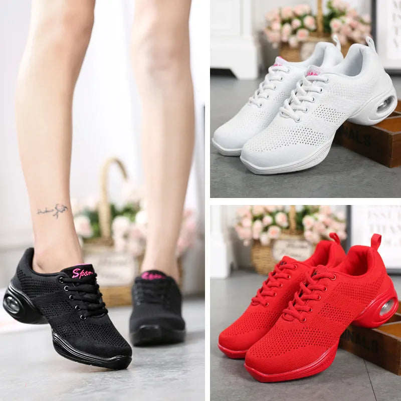 Women's white breathable fly woven mesh dance shoes with soft PU sole on a wooden floor.