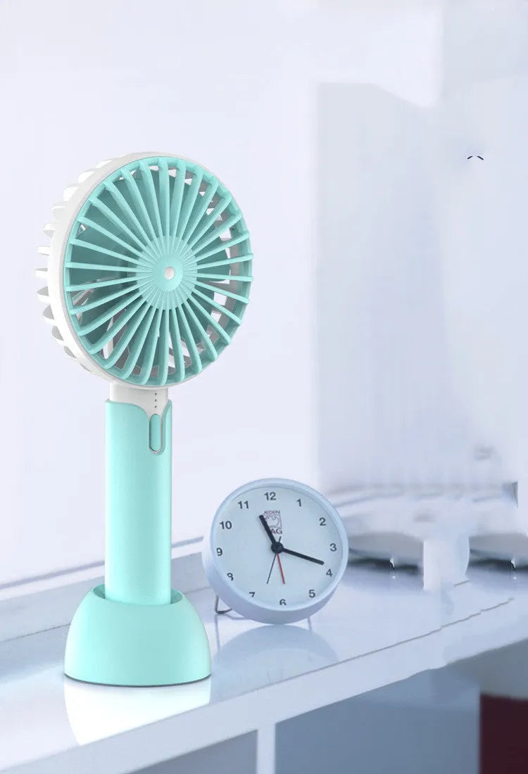 Blue handheld mini desktop USB electric fan with three speed settings and oscillating head