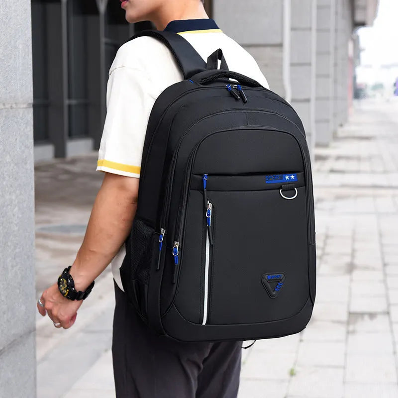 Men's large capacity Oxford cloth schoolbag in red with spliced design and air pillow straps.