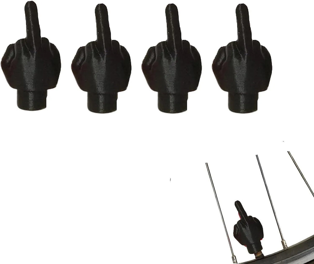 Four black and four skin tone latex tyre valve caps arranged together