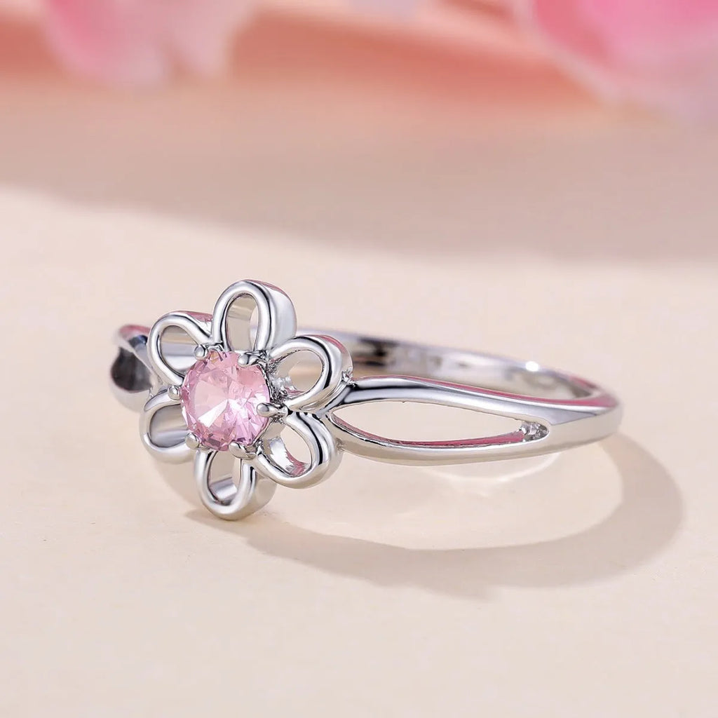 Lady's hollowed floral fashion ring in electroplated copper, platinum pink diamond colour.