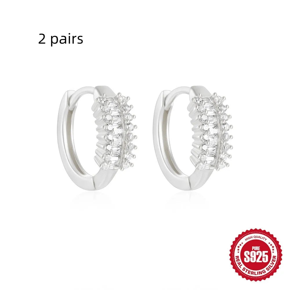 Sterling silver geometric stud earrings with small round designs in gold or silver electroplated finishes