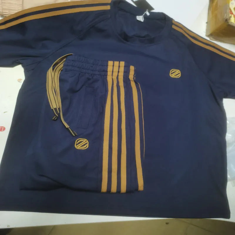 Men's blue ice silk style polyester sportswear set with short sleeve top and matching trousers