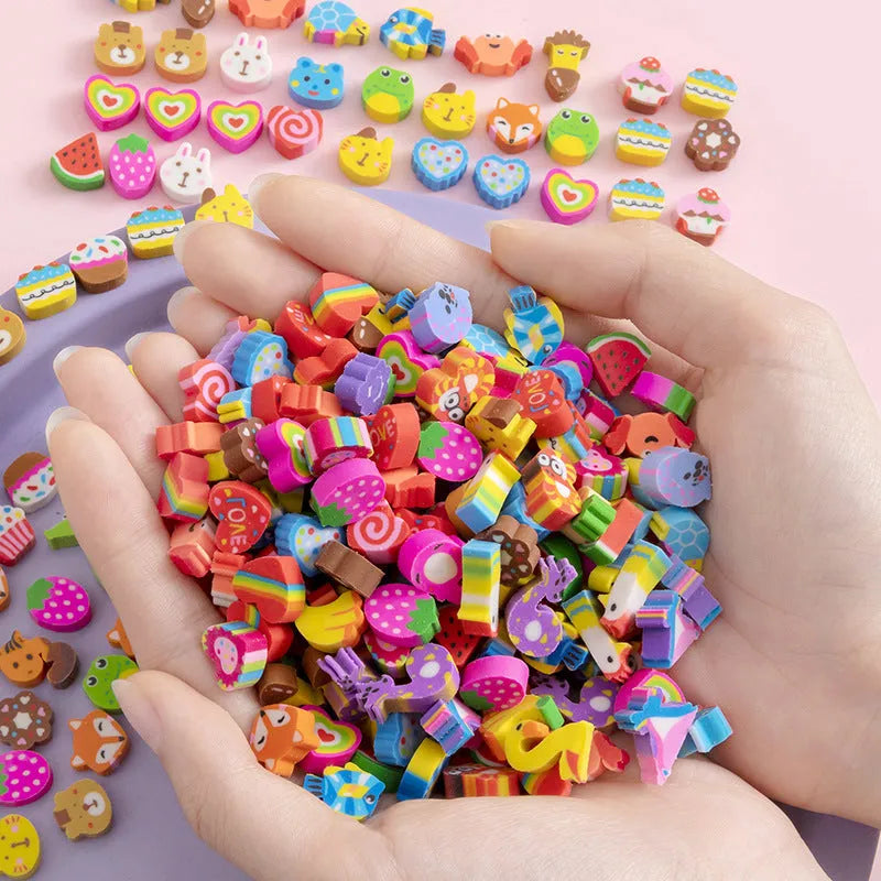 50 colourful cartoon mini erasers in shapes of fruits, animals, and cakes, displayed next to a pearlescent film bag.