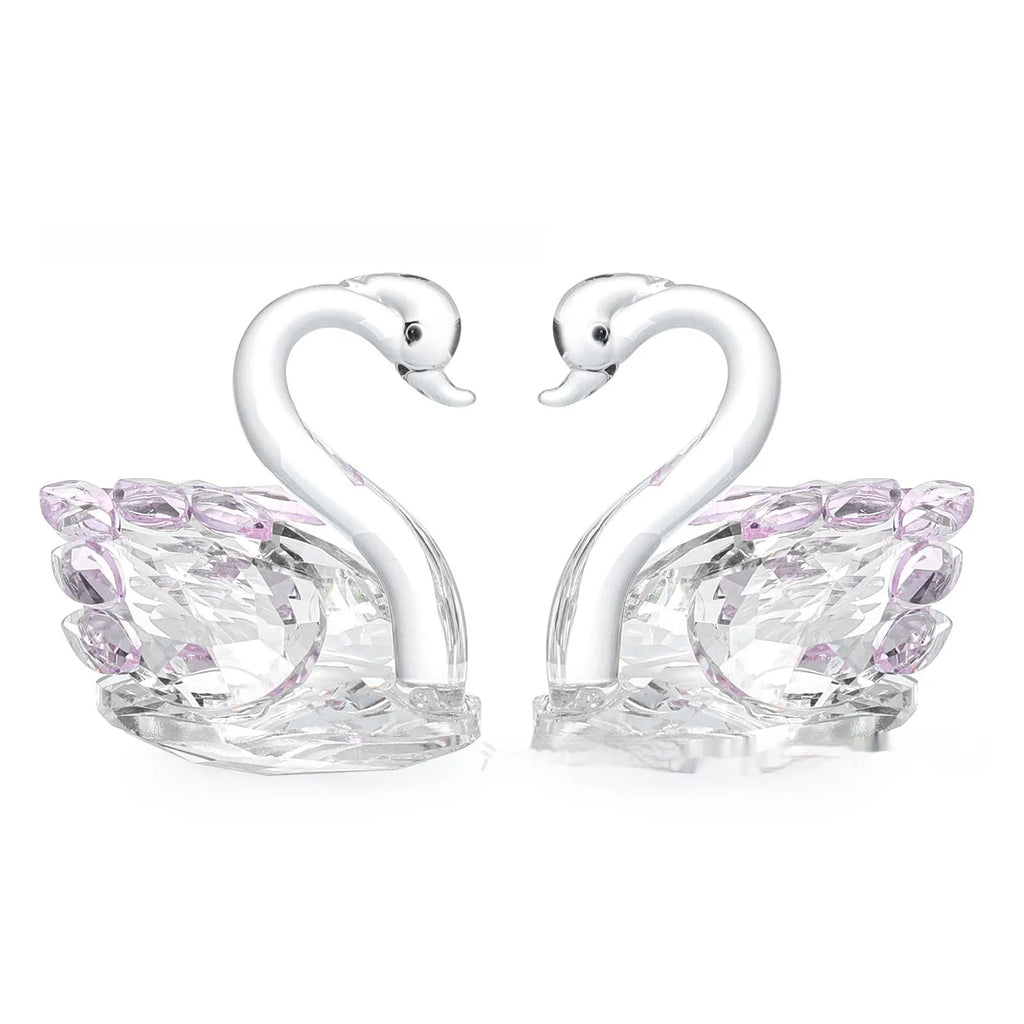 White crystal swan decoration on desktop with red, blue, pink, and violet colour options