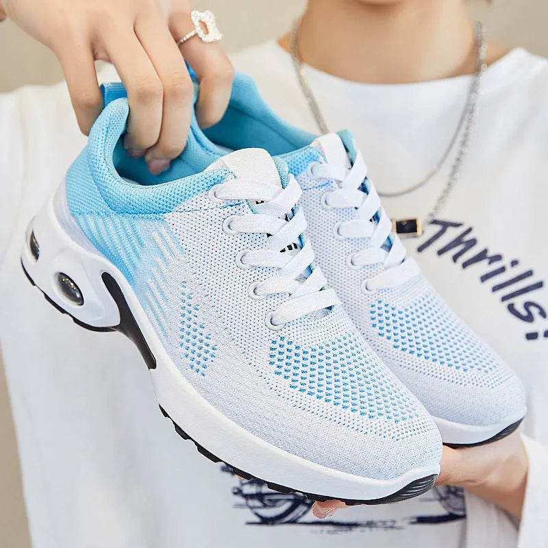 Women's pink Flyknit casual running shoes with mesh lining and flat PVC sole.