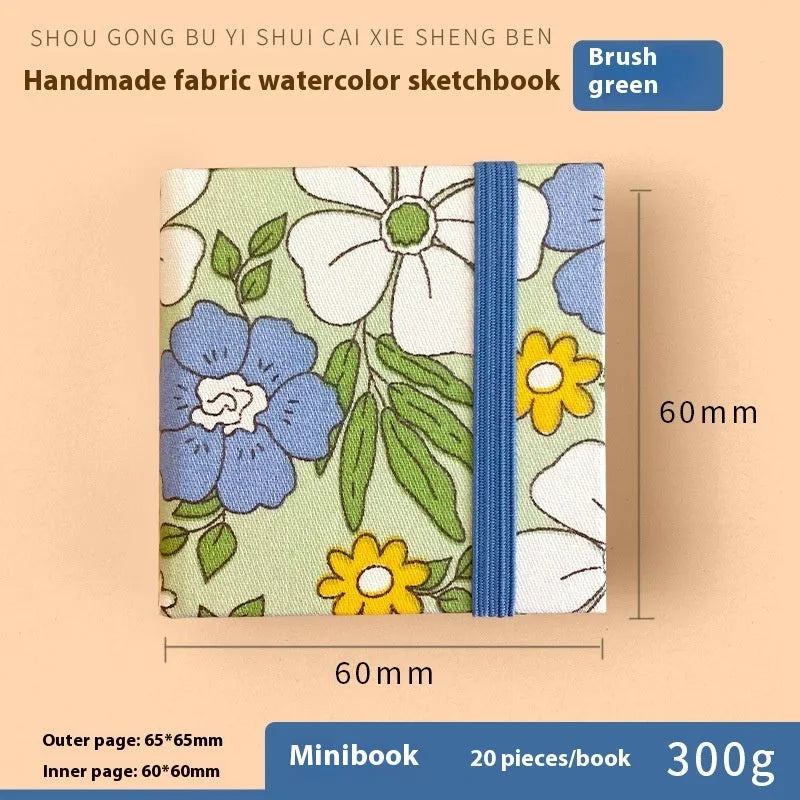 Feiluniao handmade fabric watercolour sketchbook with colourful themed cover, 185mm long.