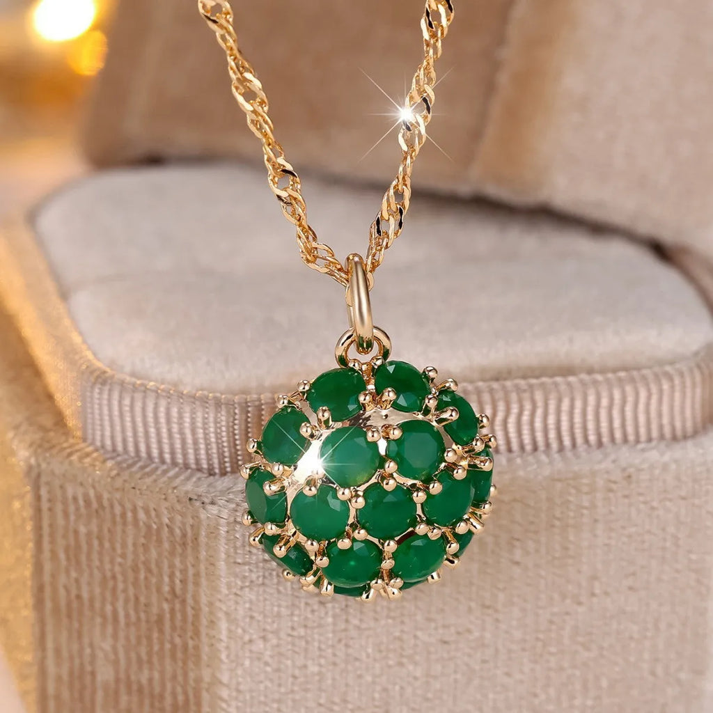 Round emerald pendant necklace with full diamond detailing in champagne gold colour on chain