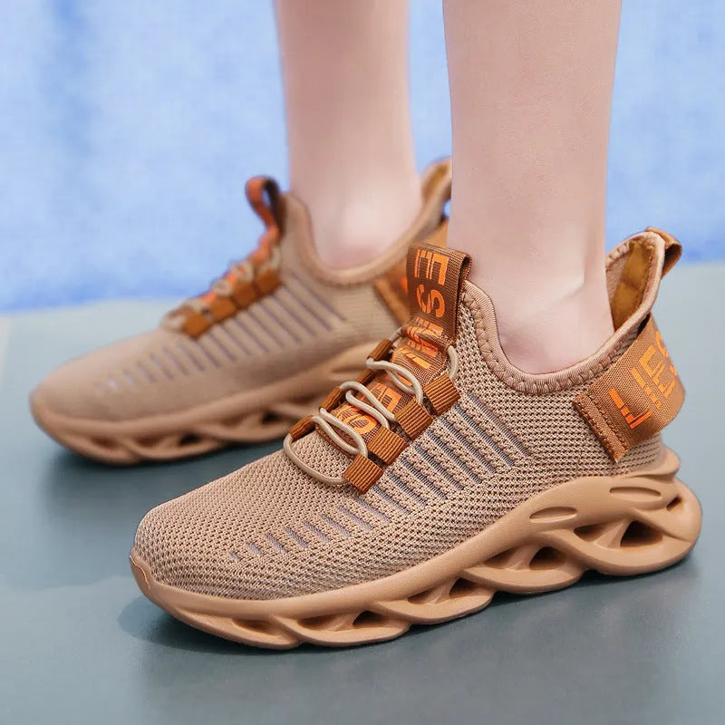 Kids black coconut sneakers with Velcro strap and fabric upper on a non-slip EVA sole.