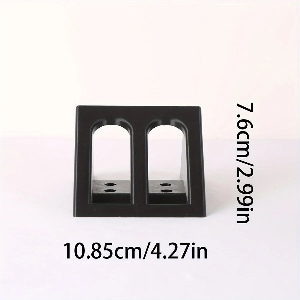 Black plastic punk-style pistol display stand for airsoft guns, measuring 10.85 by 7.6 cm.