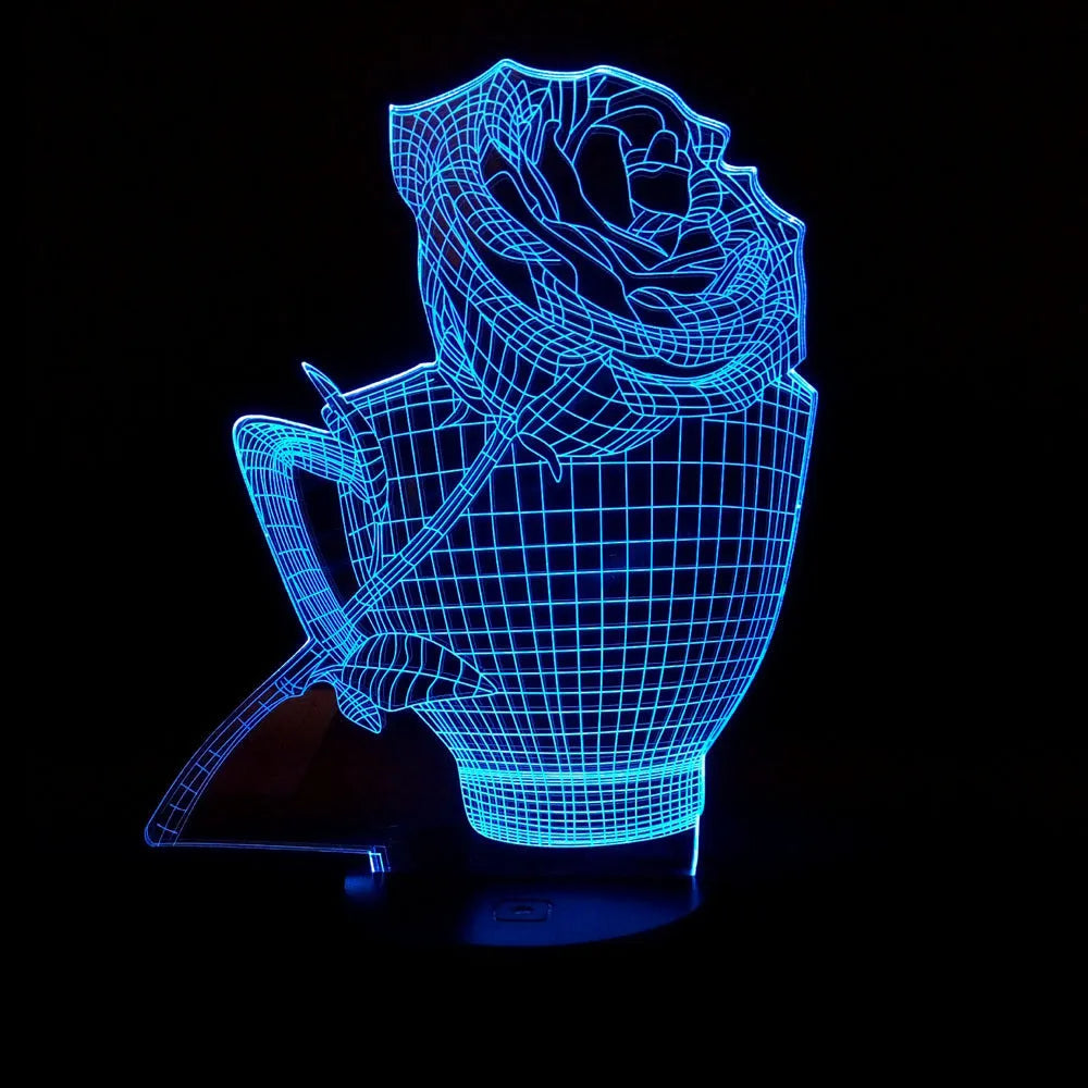 3D rose-shaped LED night light with remote control on a table, displaying a purple glow.