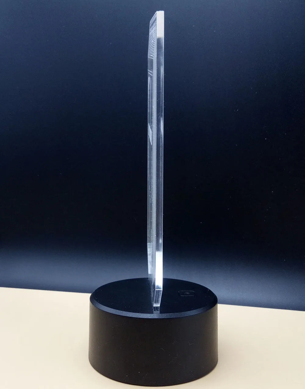 3D rose-shaped LED night light with remote control on a table, displaying a purple glow.