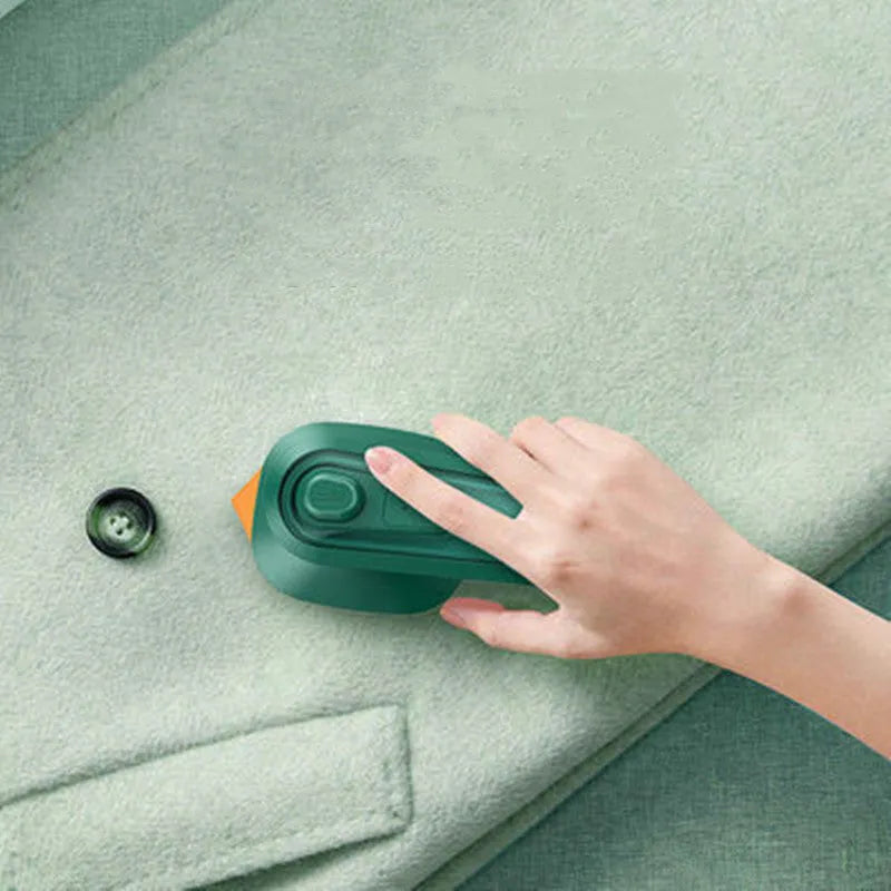 Dark green portable hanging steam iron machine with ceramic panel and compact design.