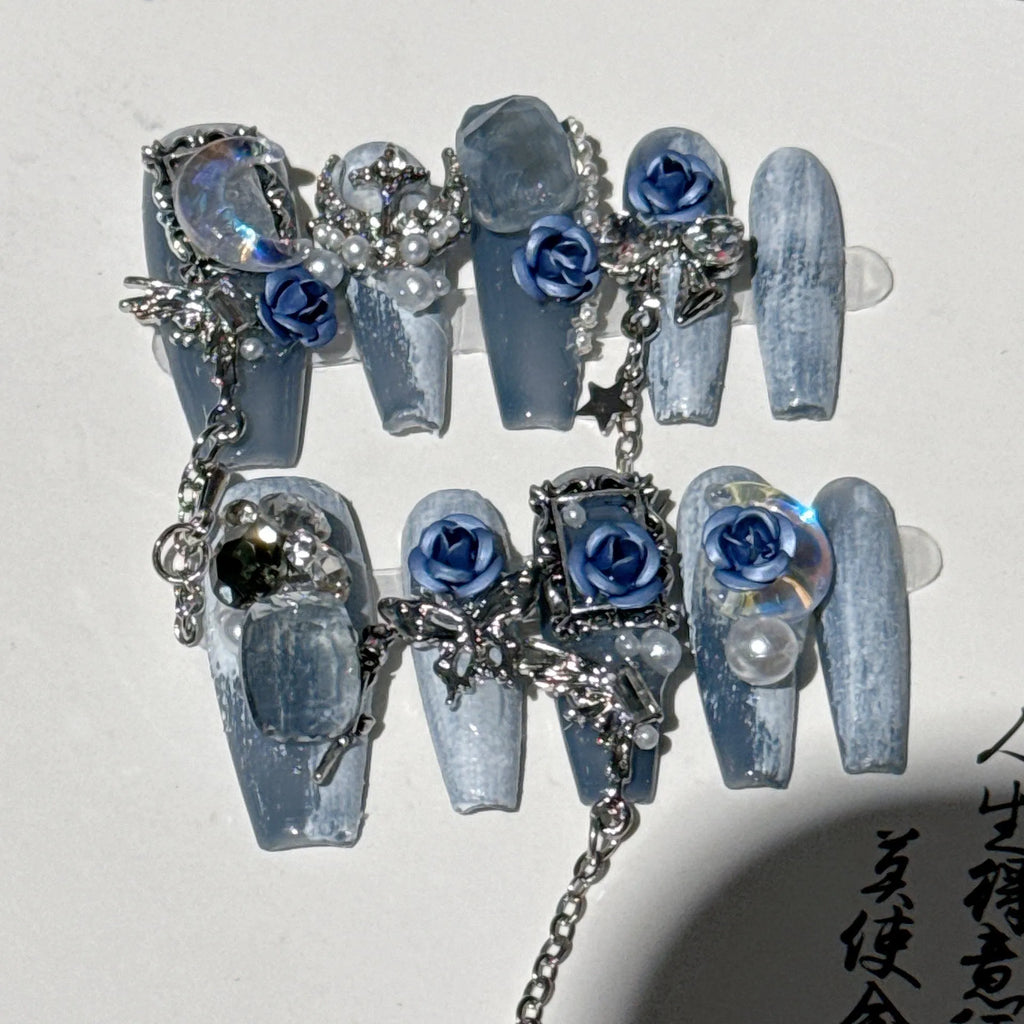 Blue manicure nails with rose tulip floral pattern in plastic armour construction