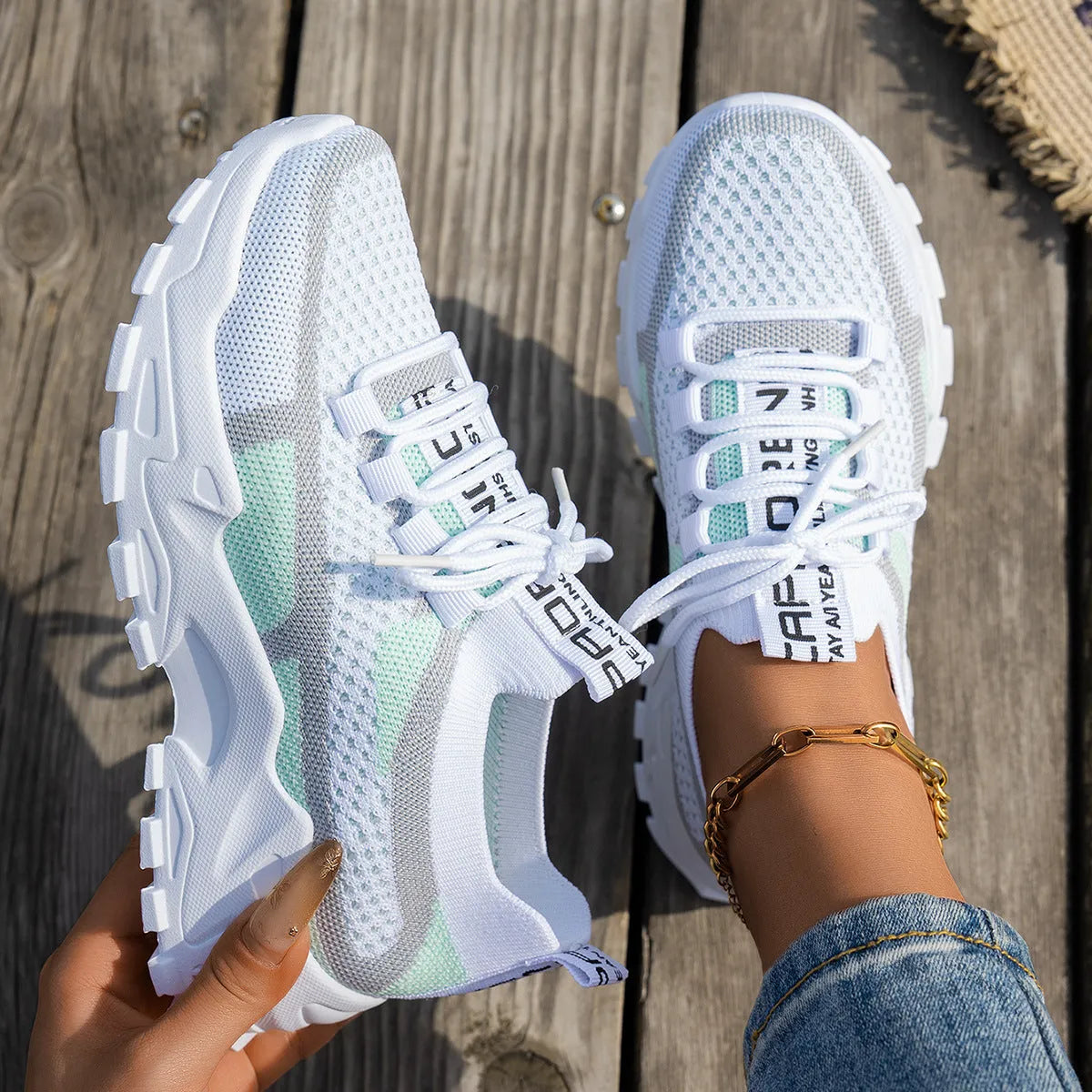 Women's Flyknit lace-up sneakers in a selected colour with a low rubber sole and round toe