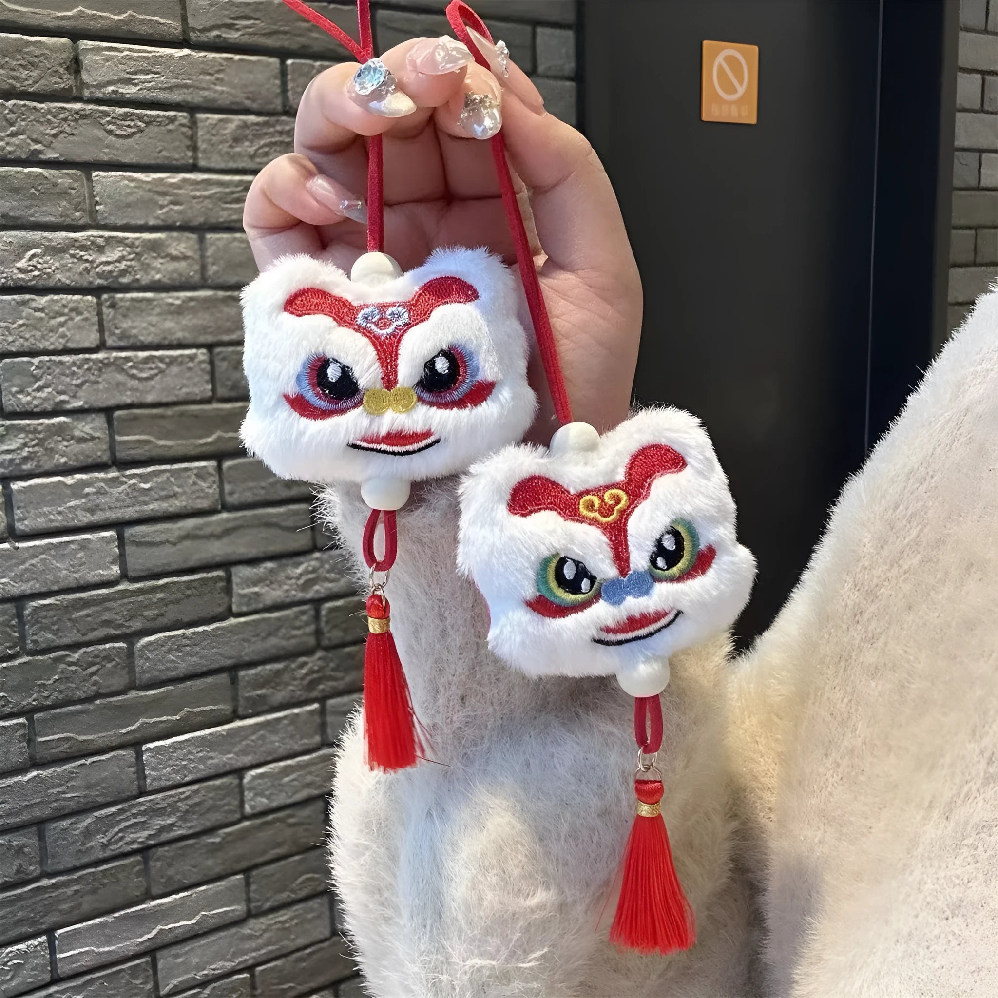 Chinese style plush lion tassel keychain ornament with star stone detail in blue or yellow