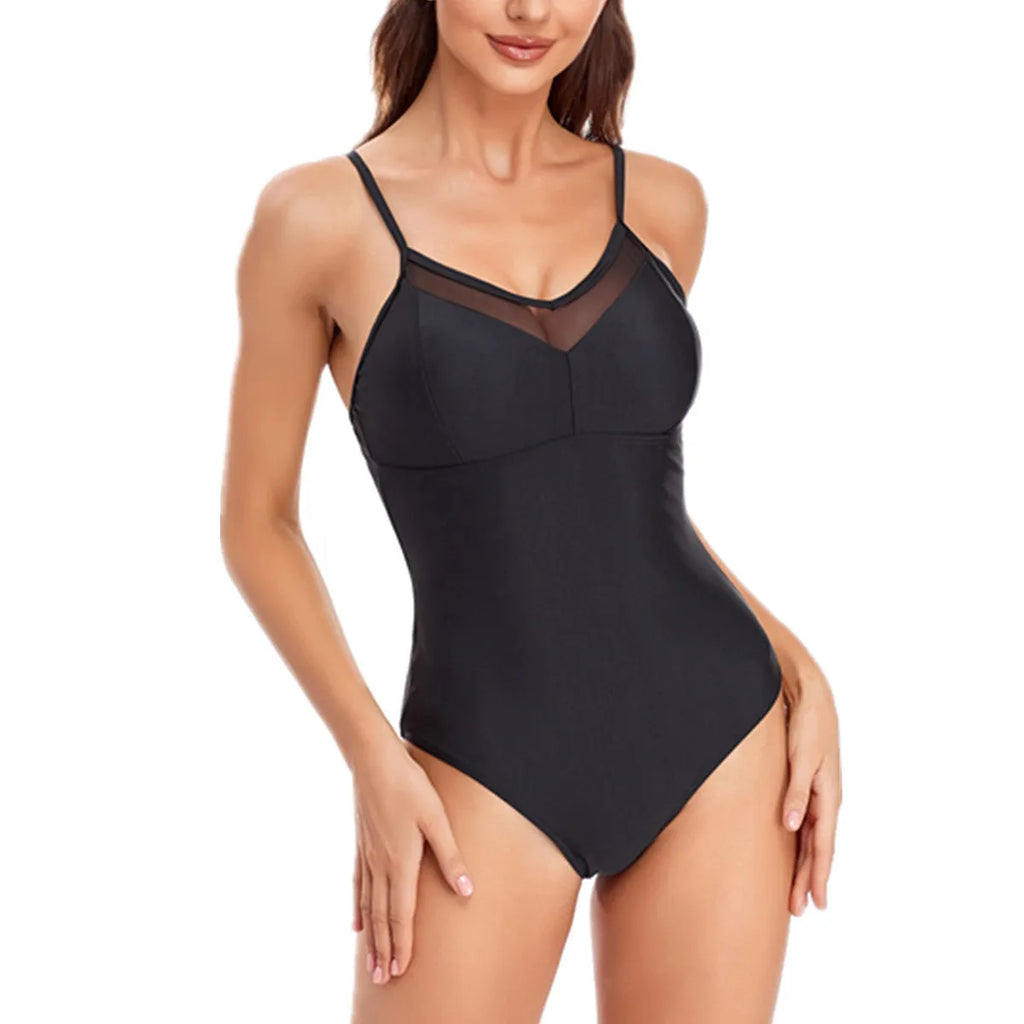 A black solid colour backless one-piece ladies swimsuit on a model.